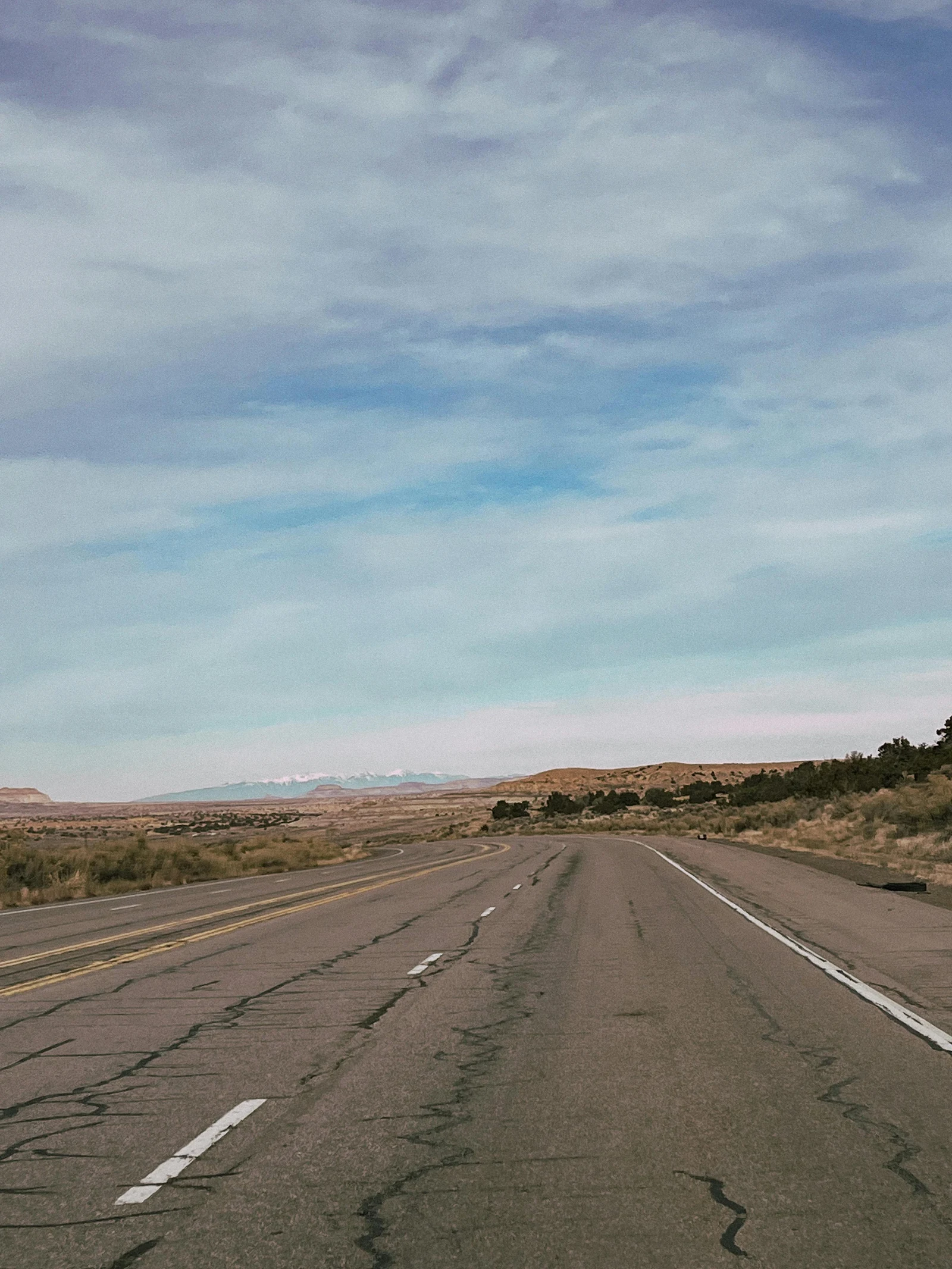 Open roadway through desert terrain